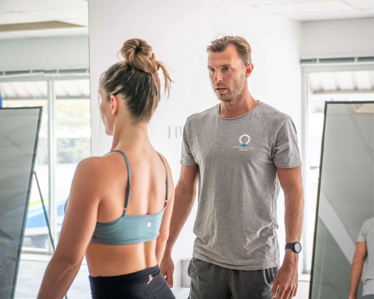 Posture specialist working with client at Functional Patterns Brisbane